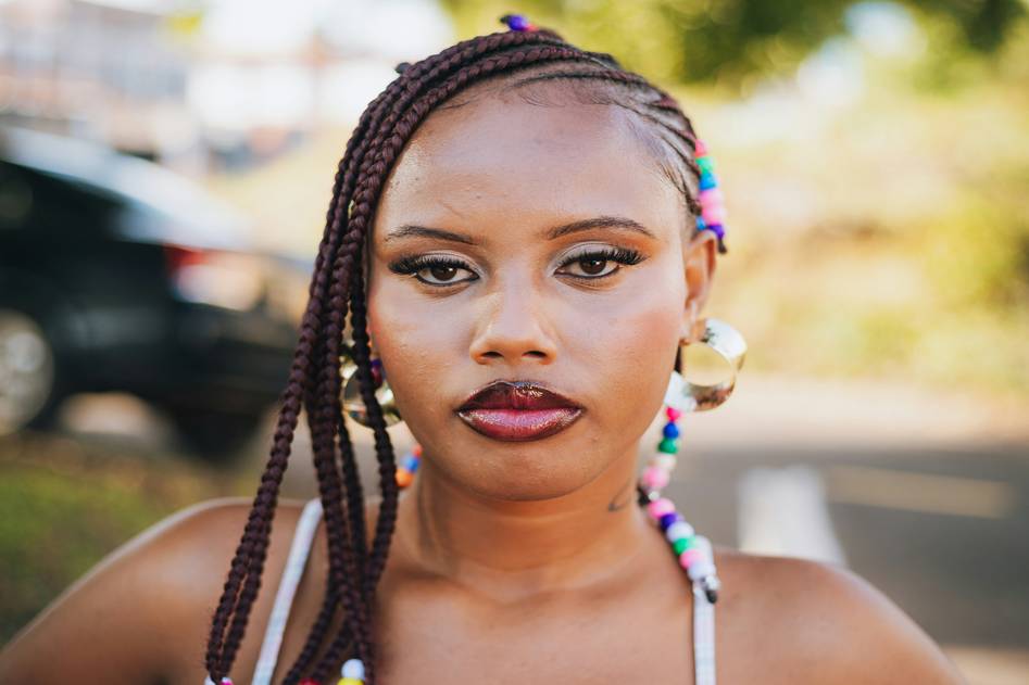 Colorful hair beads adorning braided hair in a stylish updo